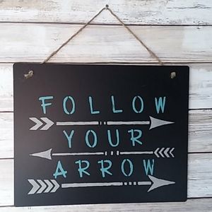"Follow your arrow" chalkboard sign